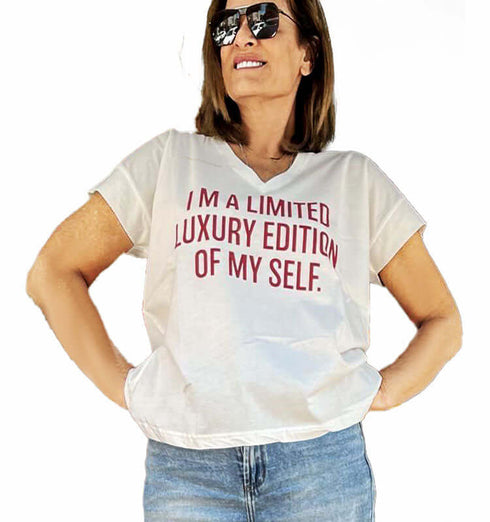 White cotton V-neck t-shirt with red text 'I'm a limited luxury edition of my self' for a stylish look.